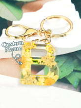 Load image into Gallery viewer, Personalized Name Light Yellow Dried Flower Letter Keychain – Custom Alphabet Bag Charm
